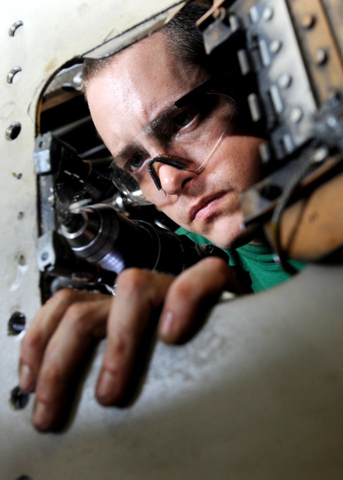 US Navy 101016-N-6427M-066 Aviation Structural Mechanic 2nd Class Ronald Lauderman, from Williamstown, W.V.,