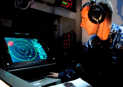 US Navy 101013-N-8913A-064 Operations Specialist Seaman Bradley S. Pool, assigned to the operations department of the aircraft carrier USS George H