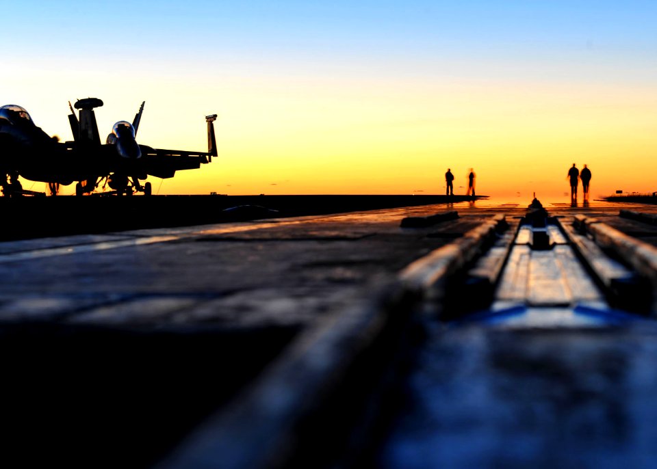 US Navy 101017-N-3374C-007 Sailors walk along a catapult on the flight deck of the aircraft carrier USS George H.W. Bush (CVN 77)
