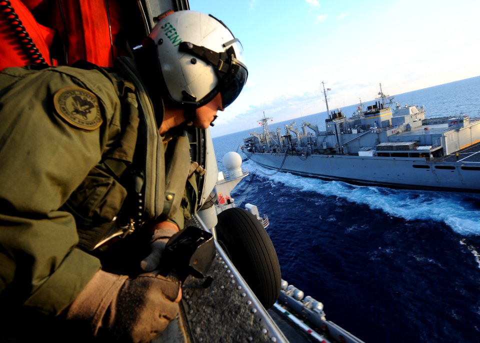 US Navy 101014-N-5082P-063 Naval Air Crewman 3rd Class Jacob A. Steinmetz guides the pilot of an HH-60H Sea Hawk helicopter