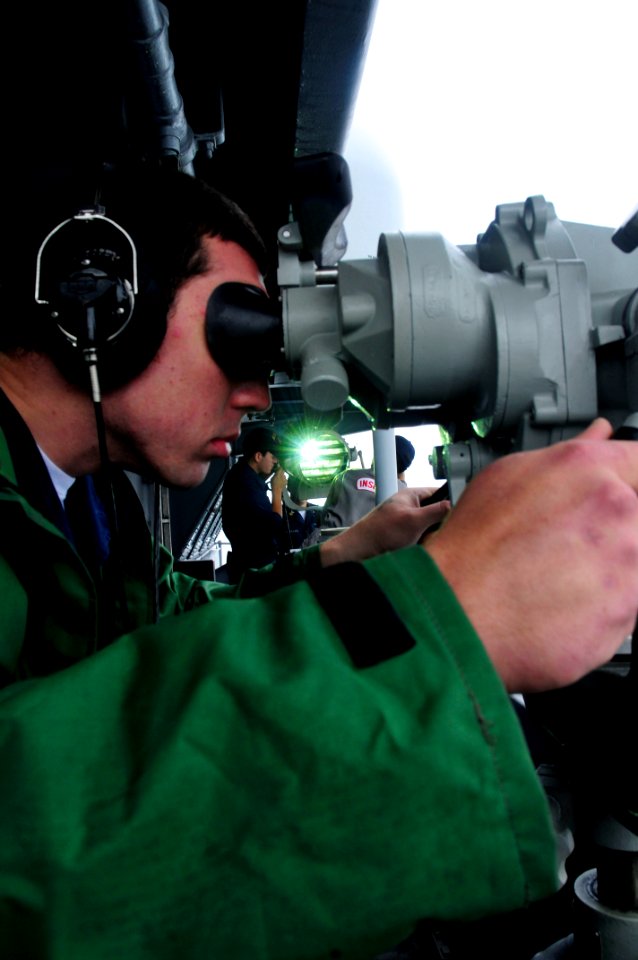 US Navy 101018-N-6006S-234 Boatswain's Mate Seaman Nick Storgion stands the forward look-out watch aboard the aircraft carrier USS Carl Vinson (CVN
