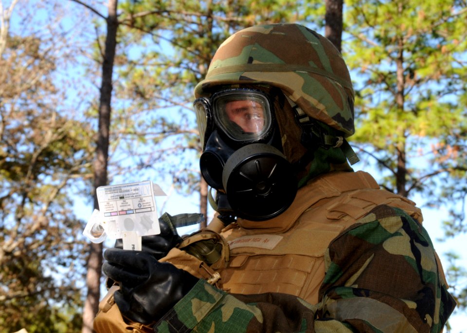 US Navy 101015-N-9564W-038 Builder 1st Class Christopher Bingham, the chemical, biological, radiological team leader assigned to Naval Mobile Const