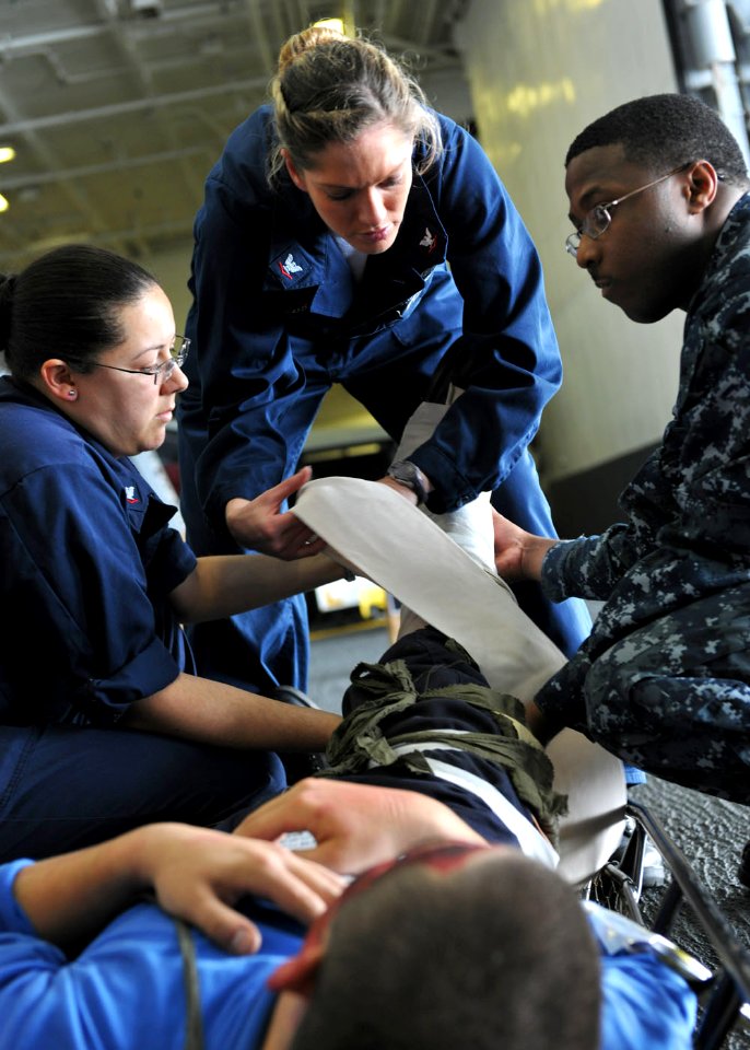 US Navy 101014-N-3374C-068 Sailors assigned to the health services department of the aircraft carrier USS George H.W. Bush (CVN 77), treat a simula