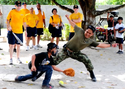 US Navy 101014-N-5538K-149 Ensign Crispin L. Cristal, right, of the Armed Forces of the Philippines, tries to beat a throw home during a pickup sof