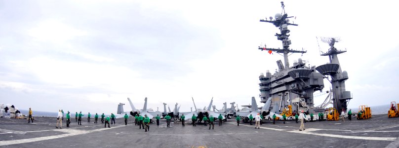 US Navy 101019-N-7103C-143 Supply department Sailors perform a foreign object and debris walk down aboard the aircraft carrier USS George Washingto