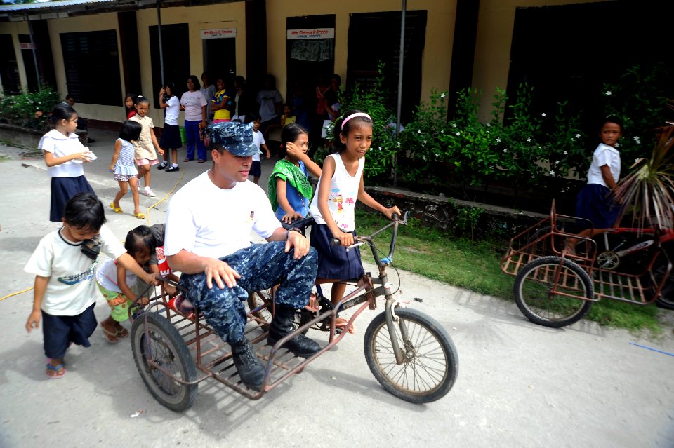 US Navy 101014-N-8335D-424 Hospitalman Cesar Castro, assigned to the amphibious dock landing ship USS Harpers Ferry (LSD 49), gets a ride during a