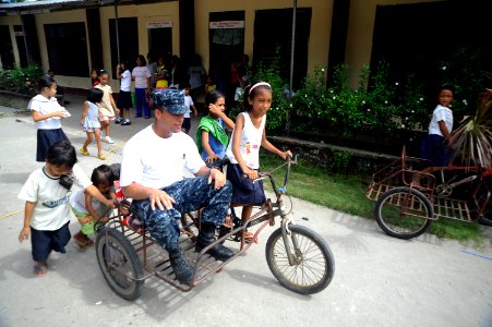 US Navy 101014-N-8335D-424 Hospitalman Cesar Castro, assigned to the amphibious dock landing ship USS Harpers Ferry (LSD 49), gets a ride during a