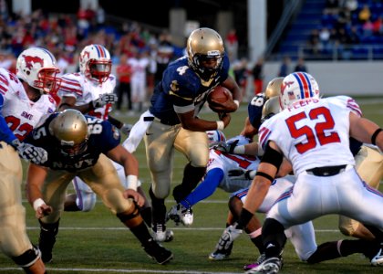 US Navy 101016-N-3857R-003 U.S. Naval Academy quarterback Ricky Dobbs (^4) carries the ball against Southern Methodist University during a college