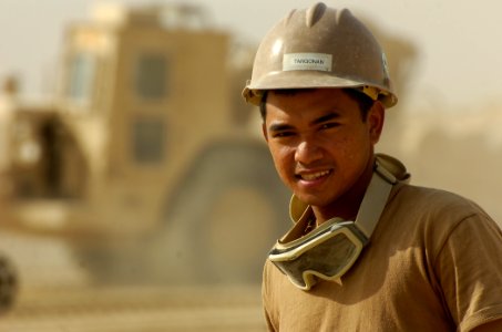 US Navy 101016-N-6436W-065 Equipment Operator Constructionman Apprentice Morbien Tangonan, a Seabee assigned to Naval Mobile Construction Battalion