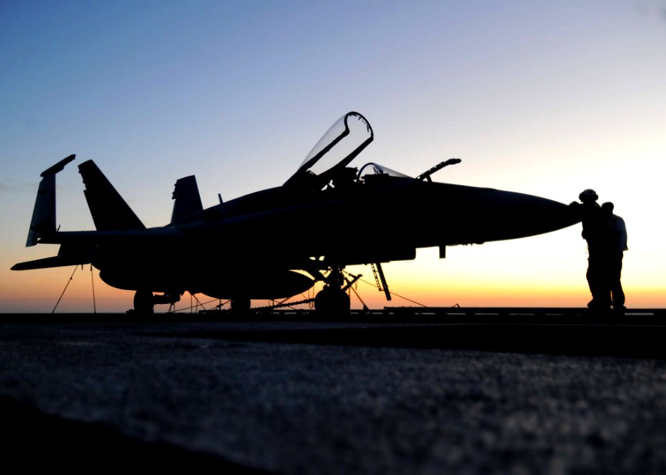 US Navy 101018-N-3885H-012 Sailors assigned to Strike Fighter Squadron (VFA) 87 wait for flight operations to begin aboard the aircraft carrier USS