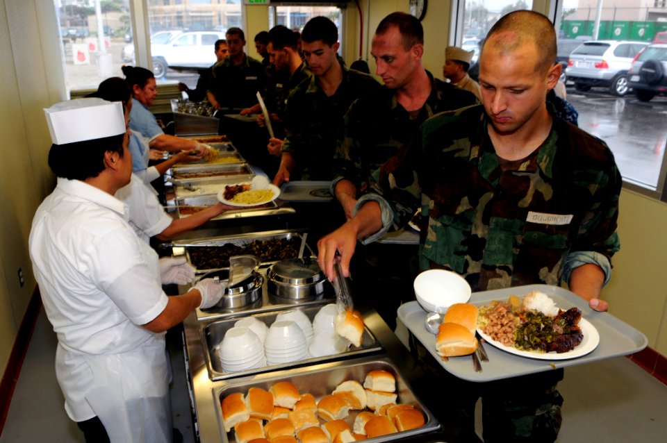 US Navy 101019-N-7883G-001 Students from Basic Underwater Demolition-SEAL (BUD-S) class 285 are served lunch for the first time at the grand openin
