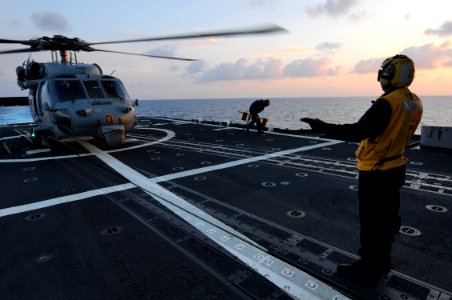 US Navy 101018-N-5016P-111 An SH-60S Sea Hawk helicopter prepares to take off from the guided-missile cruiser USS Cape St. George (CG 71) photo