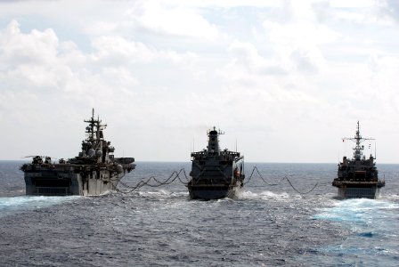 US Navy 101018-N-8335D-462 The Military Sealift Command fleet replenishment oiler USNS Pecos (T-AO 197), center, refuels the amphibious assault shi