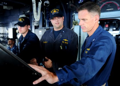 US Navy 101018-N-5016P-014 Lt. j.g. Robert Tanksley, main propulsion assistant aboard the guided-missile cruiser USS Cape St. George (CG 71) photo
