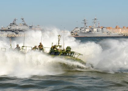 US Navy 101021-N-5085J-129 Sailors assigned to Riverine Group 1 conduct maneuvers aboard Riverine Command Boat (Experimental) (RCB-X) at Naval Stat