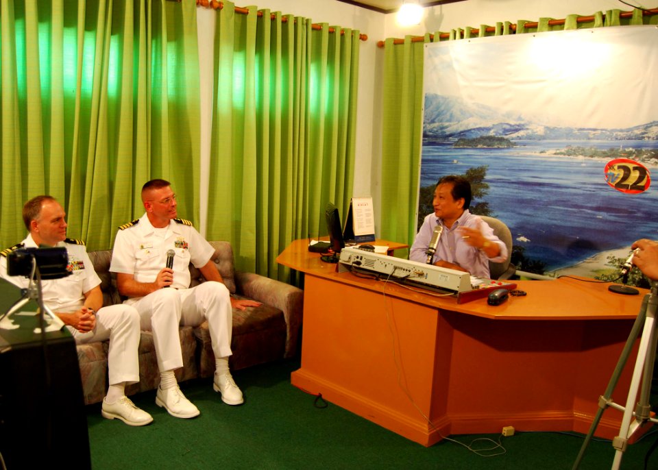 US Navy 101016-N-6770T-288 Capt. Dave Welch, center, deputy commodore of Destroyer Squadron (DESRON) 31, and Lt. Cmdr. Mike Morley, left, public af