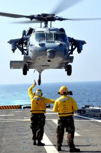US Navy 101020-N-7293M-497 An MH-60S Sea Hawk helicopter takes off from the amphibious transport dock ship USS Ponce (LPD 15)