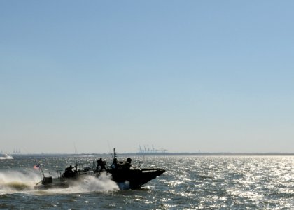 US Navy 101021-N-5085J-236 Sailors assigned to Riverine Group 1 conduct maneuvers aboard Riverine Command Boat (Experimental) (RCB-X) at Naval Stat