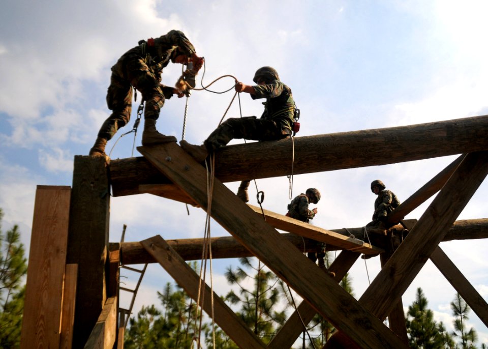 US Navy 101019-N-9564W-165 Builder Constructionman Recruit Arthur Wymer and Builder 3rd Class David Dejarnette install bracing onto a 40-foot heavy
