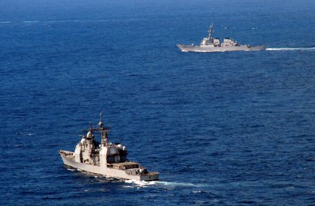 US Navy 101019-N-6632S-161 The guided-missile cruiser USS Gettysburg (CG 64), left, and the guided-missile destroyer USS Mitscher (DDG 57) are unde