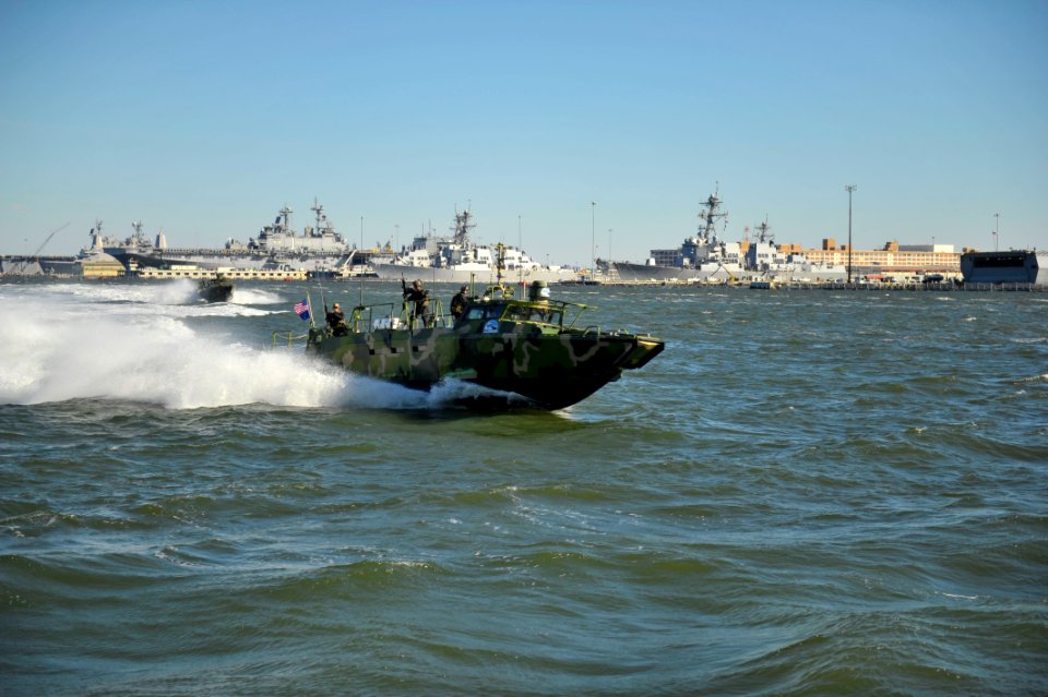 US Navy 101022-N-6889J-385 Sailors assigned to Riverine Group 1 conduct maneuvers aboard Riverine Command Boat (Experimental) (RCB-X) at Naval Stat