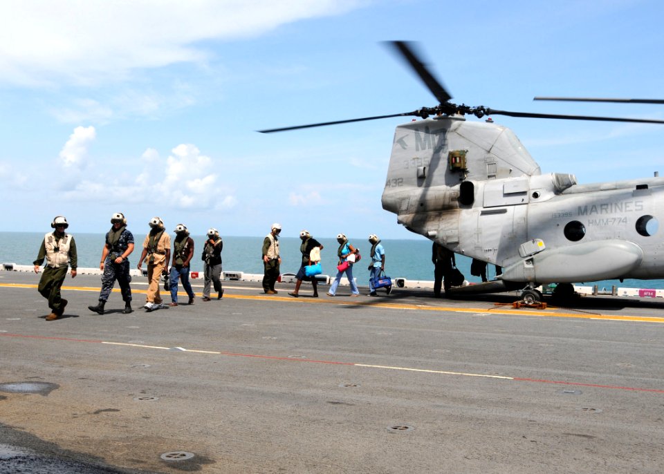 US Navy 101019-N-3265K-003 Patients from Guyana land aboard the multi-purpose amphibious assault ship USS Iwo Jima (LHD 7) to receive medical servi