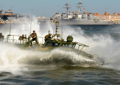 US Navy 101021-N-5085J-130 ailors assigned to Riverine Group 1 conduct maneuvers aboard Riverine Command Boat (Experimental) (RCB-X) at Naval Stati