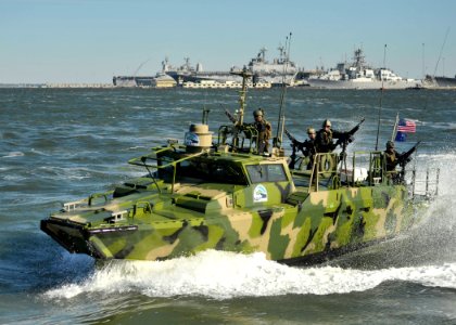 US Navy 101022-N-6889J-107 Sailors assigned to Riverine Group 1 conduct maneuvers aboard Riverine Command Boat (Experimental) (RCB-X) at Naval Stat