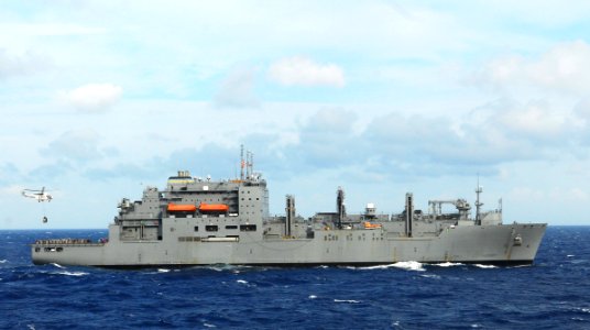 US Navy 101021-N-2218S-202 An AS332 Super Puma helicopter moves pallets of supplies from the Military Sealift Command dry cargo and ammunition ship