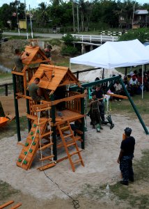US Navy 101023-N-7680E-100 Sailors and Marines embarked aboard the multi-purpose amphibious assault ship USS Iwo Jima (LHD 7) assemble playground e