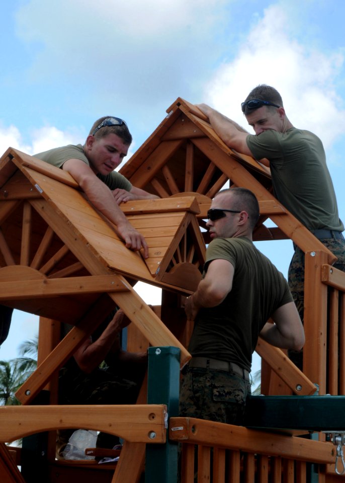US Navy 101023-N-7680E-095 Marines embarked aboard the multi-purpose amphibious assault ship USS Iwo Jima (LHD 7) assemble a playground during a Co