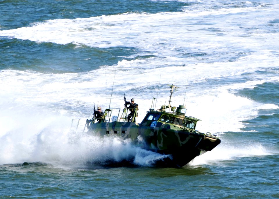 US Navy 101022-N-9565D-181 Sailors assigned to Riverine Group 1 stand their post aboard Riverine Command Boat (Experimental) (RCB-X)