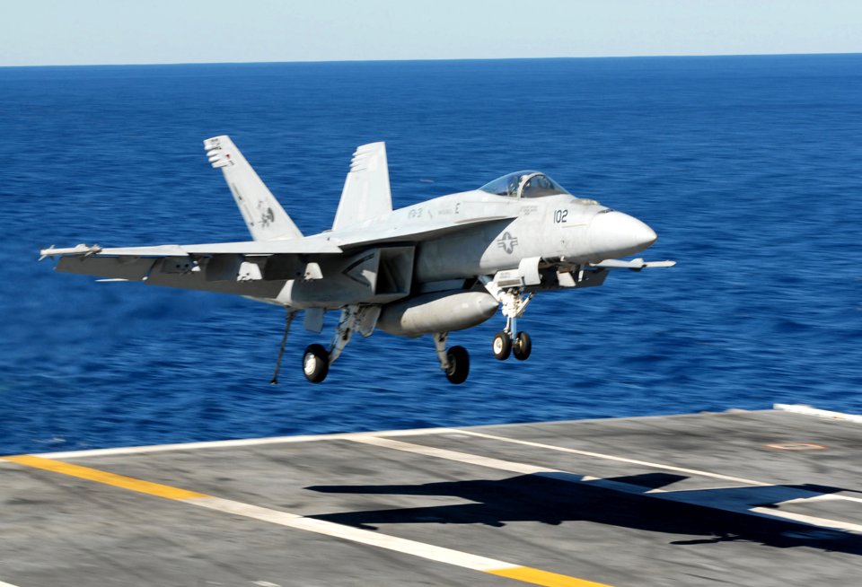 US Navy 101023-N-2686K-585 An F-A-18E Super Hornet assigned to Strike Fighter Squadron (VFA) 87 lands aboard the aircraft carrier USS George H.W. B