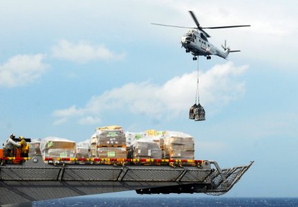 US Navy 101021-N-2218S-195 An AS332 Super Puma helicopter moves pallets of supplies to the amphibious assault ship USS Essex (LHD 2)