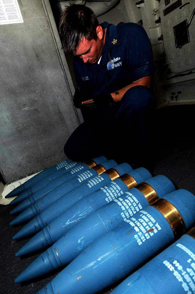 US Navy 101025-N-1854W-086 Gunner's Mate 1st Class Mike Rehfuss, assigned to the guided-missile destroyer USS Mitscher (DDG 57), documents lot numb