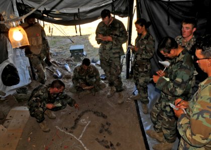US Navy 101021-N-4440L-258 Seabees assigned to Delta Company of Naval Mobile Construction Battalion (NMCB) 74, conduct a foot patrol briefing