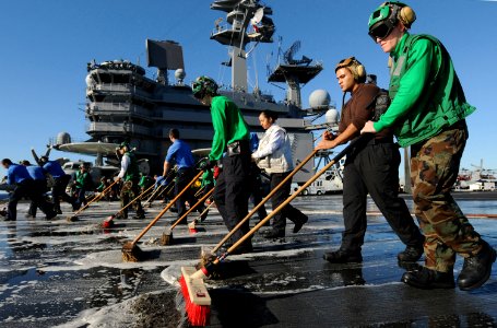 US Navy 101022-N-2686K-281 Sailors aboard the aircraft carrier USS George H.W. Bush (CVN 77) participate in a scrub exercise on the ship's flight d photo