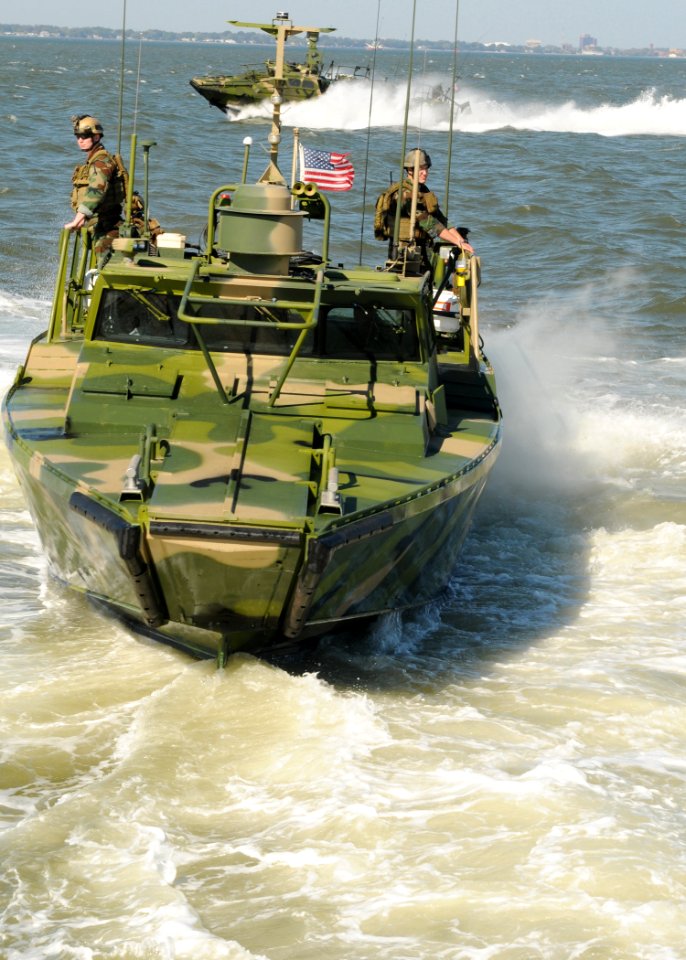 US Navy 101021-N-5085J-170 Sailors assigned to Riverine Group 1 conduct maneuvers aboard Riverine Command Boat (Experimental) (RCB-X) at Naval Stat