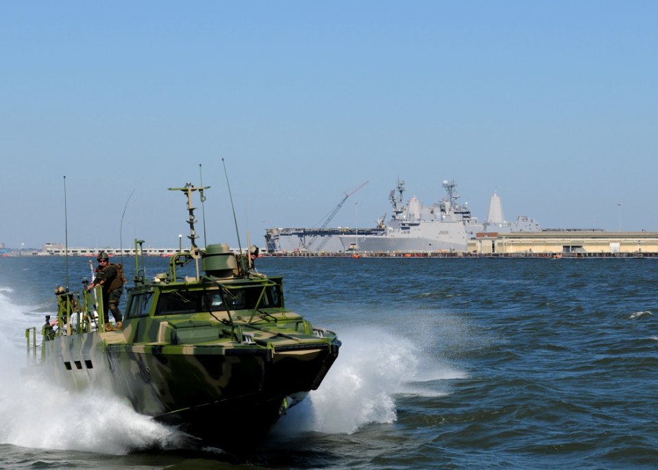 US Navy 101021-N-5085J-383 Sailors assigned to Riverine Group 1 conduct maneuvers aboard Riverine Command Boat (Experimental) (RCB-X) at Naval Stat