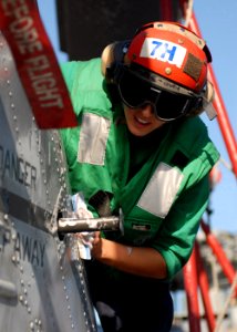 US Navy 101022-N-3737T-212 Aviation Structural Mechanic Airman Isabel Ruiz, assigned to Helicopter Maritime Strike Squadron (HSM) 70, cleans the ta
