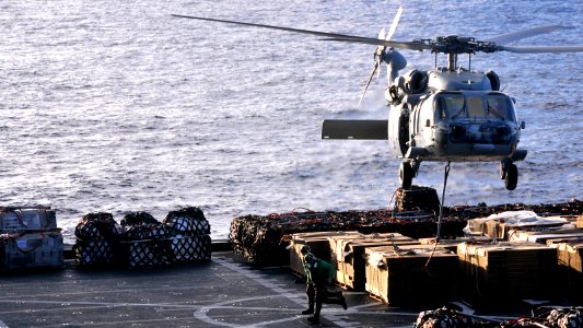 US Navy 101025-N-7103C-076 An MH-60S Sea Hawk helicopter assigned to the Island Knights of Helicopter Sea Combat Squadron (HSC) 25 lifts cargo from