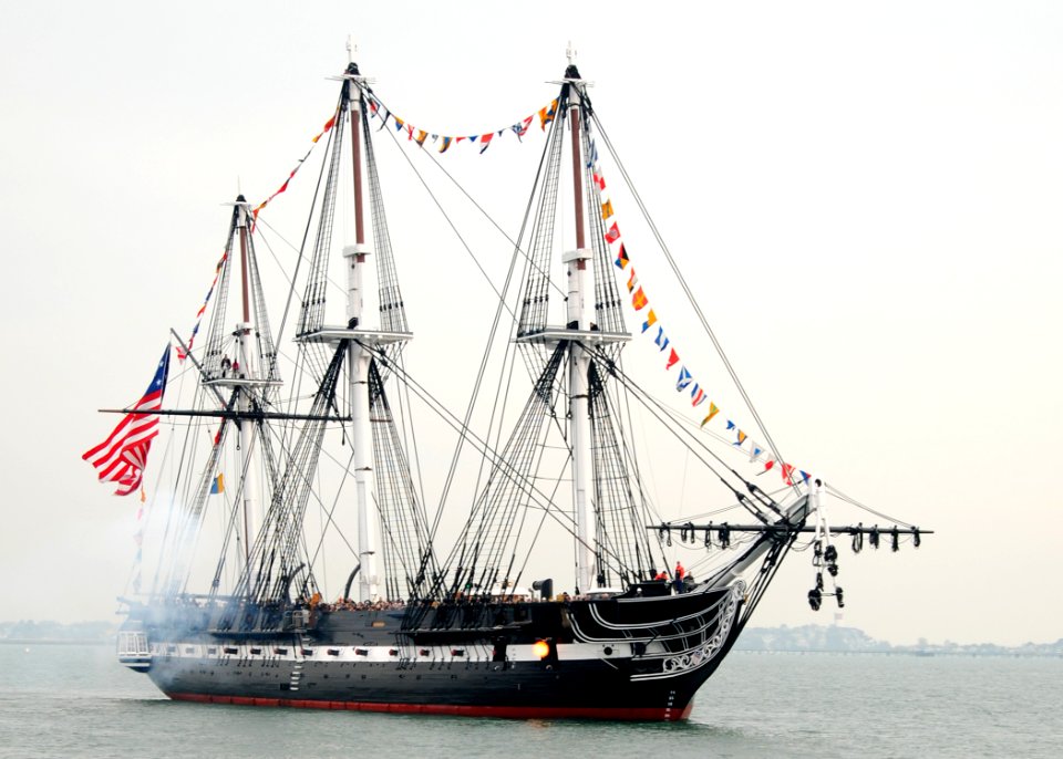 US Navy 101021-N-7642M-164 USS Constitution fires a 21-gun salute toward Fort Independence on Castle Island during an underway to celebrate the 213