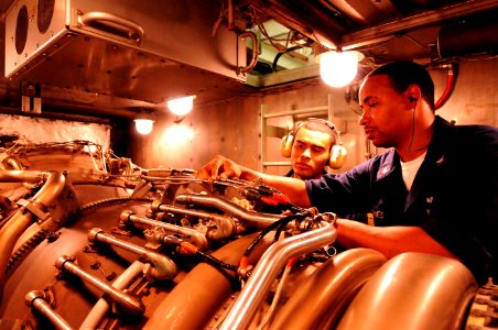 US Navy 101025-N-8913A-041 Turbine System Technician (Mechanical) 3rd Class Carrington B. Jones, right, and Enginemen Fireman Joseph W. Turner perf