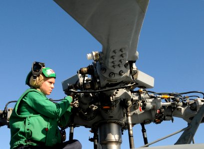 US Navy 101022-N-2686K-203 Aviation Structural Mechanic 3rd Class Katie Henninger, assigned to Helicopter Combat Sea Squadron (HSC) 9 embarked aboa