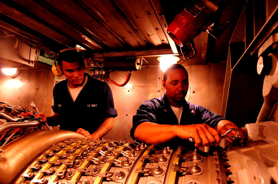 US Navy 101025-N-8913A-040 Turbine System Technician (Mechanical) 3rd Class Carrington B. Jones, right, and Enginemen Fireman Joseph W. Turner per