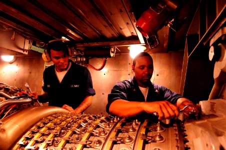 US Navy 101025-N-8913A-040 Turbine System Technician (Mechanical) 3rd Class Carrington B. Jones, right, and Enginemen Fireman Joseph W. Turner per