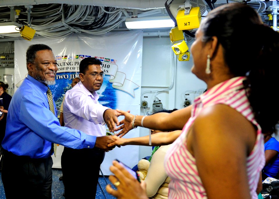 US Navy 101026-N-1531D-058 The Prime Minister of Guyana Samuel Hinds, left, meets with Guyanese patients in the medical department aboard the multi