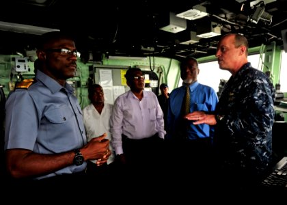 US Navy 101026-N-1531D-020 Capt. Thomas Chassee, right, commanding officer of the multi-purpose amphibious assault ship USS Iwo Jima (LHD 7), gives photo