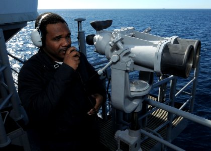 US Navy 101022-N-6632S-231 Yeoman 3rd Class Dequan B. Robinson, assigned to the executive department of the guided-missile cruiser USS Gettysburg (
