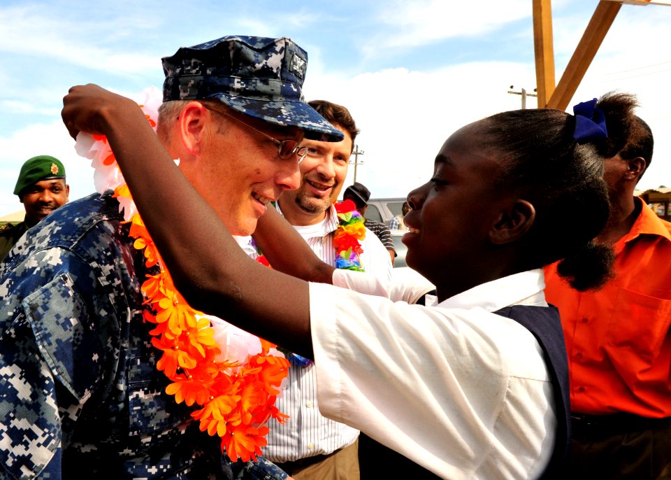 US Navy 101026-N-1531D-230 Capt. Thomas Negus, commodore of Continuing Promise 2010, receives a lay from a girl during a ceremony closing the Guyan